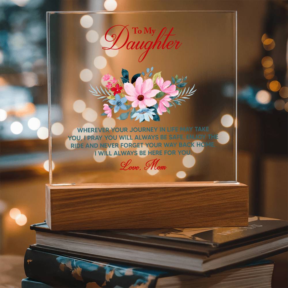 To My Daughter keepsake acrylic plaque with floral design and heartfelt message, displayed on a wooden stand with warm bokeh lighting